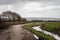 General view over Braunton Marshes near Barnstaple, Devon, England, with stream.