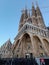 General View Pasion facade of The Basilica the Sagrada Família with blue sky