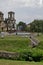 General view of public garden in residential district with new orthodox church, artificial ponds, fountain and bridges