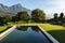 General view of tranquil swimming pool in stunning mountains countryside