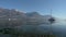 A general view of the tranquil waters and surrounding mountains in Oliveto Lario, Lake of Como, Lombardy, Italy.