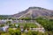 General view of Vindhyagiri hill temple complex, Sravanabelgola, Karnataka. View from Chandragiri hill. Large Belgola, white pond,