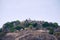 General view of Vindhyagiri hill temple complex, Sravanabelgola, Karnataka. View from Chandragiri hill. Large Belgola, white pond,