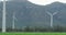 General view of wind turbines in countryside landscape with mountains