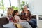 Generational bonding, grandmother, daughter, and grandchild sharing stories on a cozy afternoon