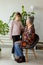 Generational Bonding: A Heartwarming Encounter Between a Grandmother and Granddaughter Indoors