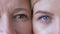 Generational comparison, eyes of caucasian mom and daughter next to one another looking together at camera