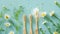 Generative AI Bamboo toothbrushes beautiful chamomile flowers sea salt and herbs on turquoise background flat lay