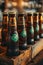 Generative AI. Chilled beer bottles, with four-leaf clover logos in a cozy pub to celebrate St. Patrick\\\'s Day.