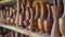 Generative AI Close up many groups of handmade wooden vase stock on the shelf at the vase store Vase stock is read