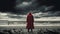 Generative AI conceptual illustraion of single person on moody beach in contrasting red coat to depict loneliness or depression or