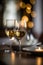 Generative AI dining table for two people. Bottle of white wine and two glasses. bokeh blurred background