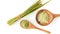 Generative AI Fresh lemongrass leaf with dry lemongrass slice and lemon grass powder in wooden spoon isolated on w