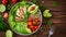 Generative AI Healthy salad bowl with quinoa, tomatoes, chicken, avocado, lime and mixed greens, lettuce, parsley