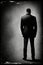 Generative AI Illustration.A gloomy dark concept of a dark figure of a man shrouded in fog and standing with his back to