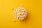 Generative AI Image of Crunchy Popcorn Snack in a Bowl on Yellow Background