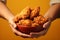 Generative AI Image of Hands Holding a Bowl of Crispy Fried Chicken