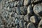 Generative AI Image of Tilt Angle Shot of Dark Natural Rock Stone Wall with Rough Texture
