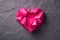 Generative AI. Origami paper hearth with shadow. Hot pink polygonal paper heart for Valentine's day
