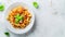 Generative AI Top view of appetizing homemade pasta with Bolognese sauce served with fresh basil leaves on white p