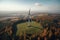 Generative AI, wind turbines in a field, green farm landscape. Environmentally eco-friendly power generation.