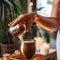 Generative ai. Woman hands. Beautician pouring coconut essential oil