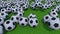 Generic football balls rolling and bouncing on green grass field. 4K ProRes clip