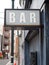 Generic inner city vibe BAR sign with tons of character