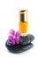 Generic Perfume and Purple Flower on stone, white background