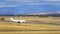 Generic plane rolling along the slope next to some high mountains, Madrid Spain.