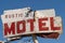 Generic rustic motel sign is decaying and abandoned in California