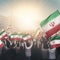 Generic unrecognizable crowds cheering or demonstrating with waving Iranian flags in Tehran of Iran. Digitally generated rendering
