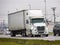 Generic White 18 Wheeler In Wet Traffic During Winter