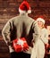 Generosity and kindness. Surprising his wife. Prepare surprise for darling. Winter surprise. Man carry gift box behind