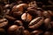A generous pile of rich, dark roasted coffee beans, perfect for brewing a flavorful cup of coffee that will invigorate your senses