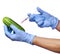 Genetic injection into cucumber isolated on white background. Genetically modified vegetable and syringe in his hands