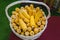 Genetically modified corn in basket at agricultural exhibition, top view