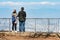 Geneva, Switzerland - April 14, 2019: A couple from the Mont Selave viewing platform look at Geneva and the surrounding area. Rear