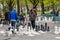 Geneva, Switzerland - April 16, 2019: People playing traditional oversized street chess in Parc des Bastions