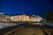 Geneva, Switzerland - August 30 2023: Rhone River and scenic view of building facades in the city of Geneva illuminated at night