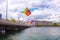 Geneva, Switzerland - June 17, 2016: Lake, Embankment, flags, bridge