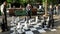 GENEVA, SWITZERLAND - JUNE, 7, 2019: player contemplating next move in an outdoor chess game in geneva