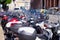 Genoa, Italy - September, 25, 2019: Motorcycles, scooters, bikes, mopeds Parking on street of Genoa city in Italy