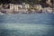 Genoa, Italy - view of city coastline and sail surfer