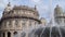 Genoa, Liguria, Italy - circa 2019: Genova fountain Piazza de Ferrari. The famous fountain and the surrounding buildings at Piazza