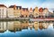 Gent, Belgium. Sunrise in historical center of Ghent with medieval buildings of Korenlei, Graslei and castle of the counts