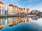 Gent, Belgium. Sunrise in historical center of Ghent reflecting