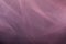 Gentle abstract translucent background from tulle of berry color