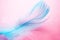 Gentle background with blue feather on a pink background close-up, soft focus