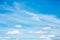 Gentle blue sky with white beautiful cirrus clouds, natural heavenly abstract background with good weather
